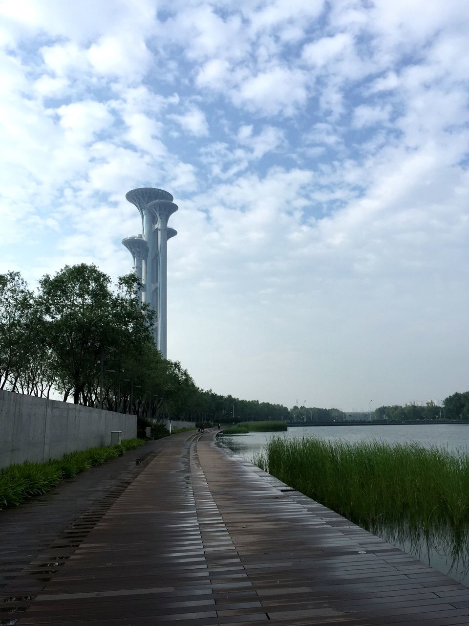 the way forward, sky, built structure, architecture, cloud - sky, diminishing perspective, tree, building exterior, footpath, walkway, vanishing point, cloud, pathway, cloudy, grass, leading, day, cobblestone, road, empty