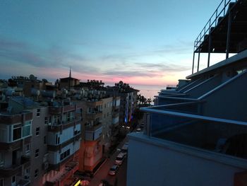 High angle view of buildings against sky at sunset