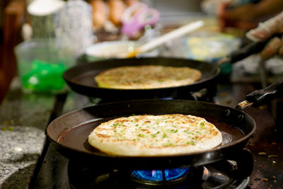 Cropped hand preparing food