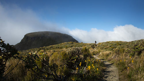 Panoramic view of land and mountains against sky