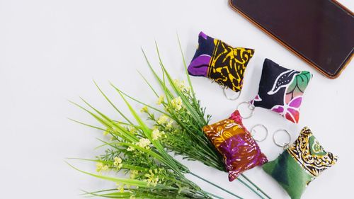 High angle view of multi colored keychain accessories on table