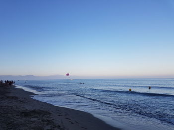 Scenic view of sea against clear blue sky