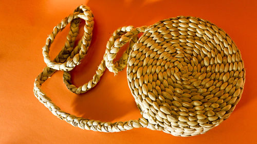 Close-up of sculpture against orange background