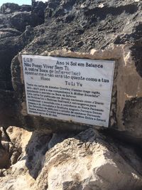 Close-up of text on rock formation