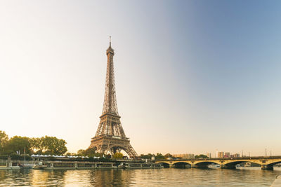 View of eiffel tower in autumn with seine river in a sunny day