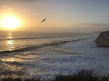 Scenic view of sea against sky during sunset