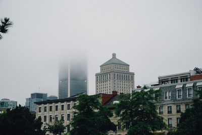 Low angle view of skyscrapers against clear sky