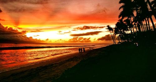 Scenic view of beach against sky during sunset