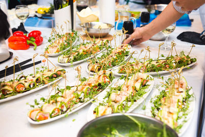 Salted trout rolls with zucchini, cottage cheese and a bouquet of micro herbs