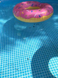 High angle view of inflatable ring floating in swimming pool