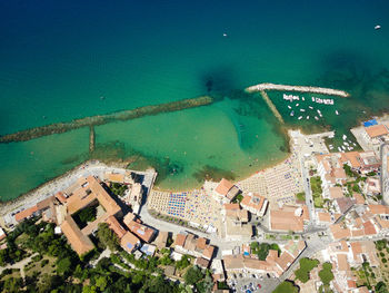 High angle view of buildings by sea