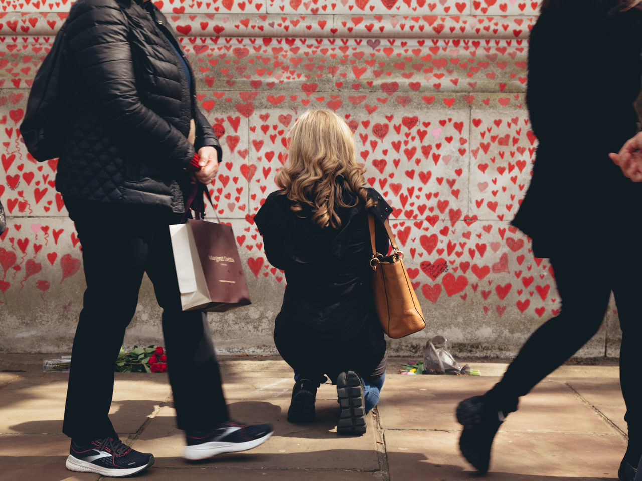 women, footwear, red, adult, full length, group of people, clothing, togetherness, person, female, small group of people, men, standing, emotion, young adult, performance art, rear view, fashion, indoors, child, trousers, casual clothing