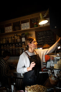 Cafe owner busy at work