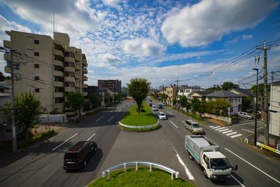 High angle view of vehicles on road against sky