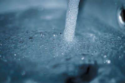 Close-up of water drops on metal