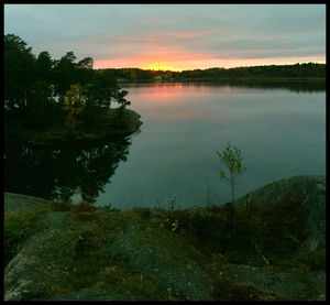 Scenic view of lake at sunset