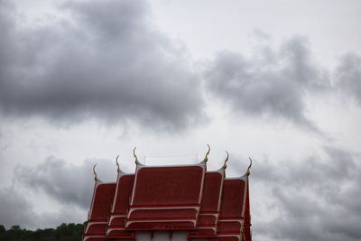 Low angle view of building against cloudy sky