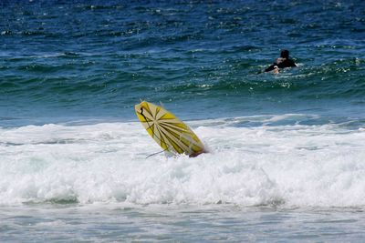 People swimming in sea