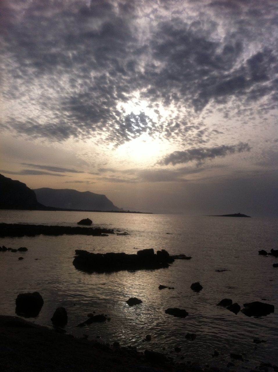 water, sky, sea, tranquil scene, scenics, tranquility, beauty in nature, cloud - sky, sunset, horizon over water, beach, nature, cloudy, shore, idyllic, cloud, silhouette, reflection, rock - object, dusk