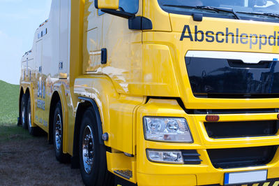 Yellow vehicle parked on field