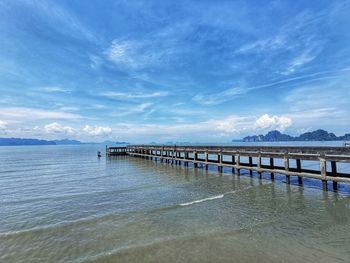 Pier over sea against sky
