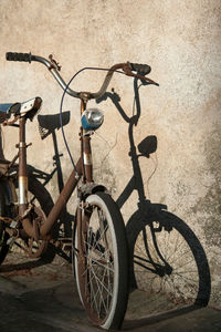 Bicycle leaning against wall