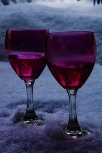 Close-up of red wine in wineglass