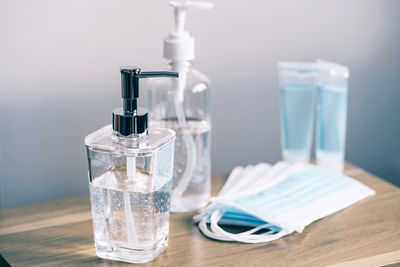 Close-up of water in glass bottle on table