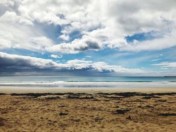 Scenic view of beach against sky