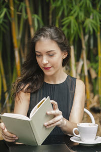 Young woman holding book