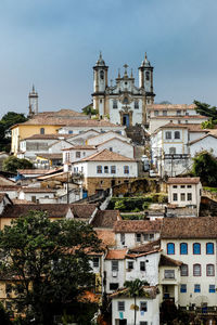 Church of nossa senhora do carmo amidst houses against sky