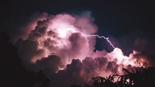 Low angle view of smoke at night