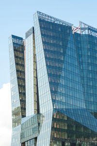 Low angle view of modern buildings against clear sky