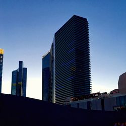 Low angle view of modern buildings against clear sky