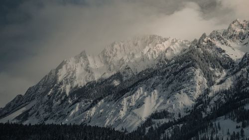 Scenic view of mountains against sky during winter