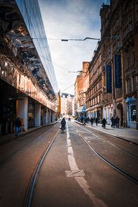 Road in city against sky