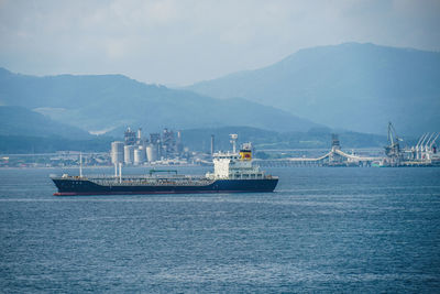 Boats in sea against sky