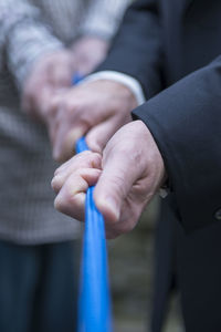 Close-up of people holding hands