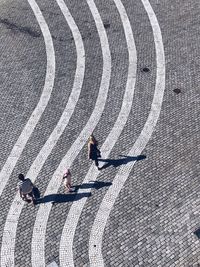 High angle view of man walking on street