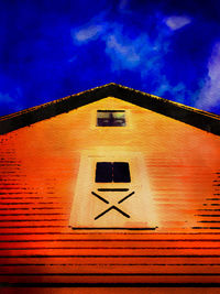 Low angle view of building against blue sky