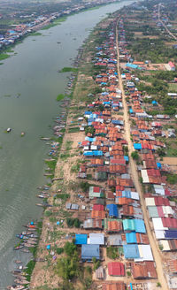 High angle view of buildings by canal in city