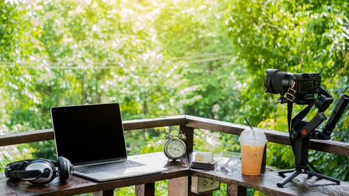 Telephone booth on table against trees