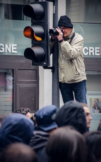 Full length of man photographing