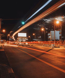 Light trails on road in city at night