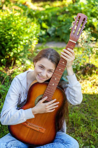 Young woman playing guitar