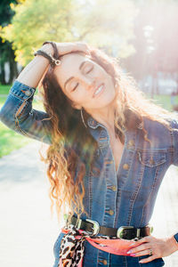 Portrait of young woman using mobile phone