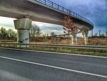 View of bridge against cloudy sky