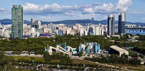 Panoramic view of buildings in city against sky