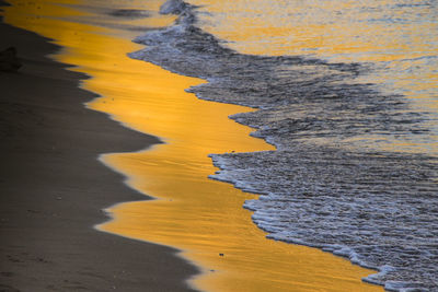Close-up of yellow sand at beach