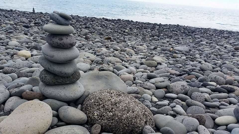 STACK OF PEBBLES ON SHORE